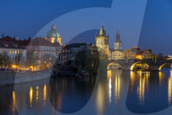 View over Charles Bridge, Old Town Bridge Tower and Vltava River at dusk, Prague, Bohemia, Czech Republic, Europe