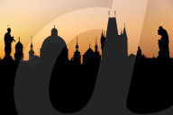 Silhouette of the old town buildings seen from Charles Bridge at sunrise, Prague, Bohemia, Czech Republic, Europe