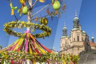 St. Nicholas' Church seen from the Easter Market at the old town market square, Prague, Bohemia, Czech Republic, Europe