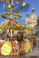 Easter Market at the old town market square with St. Nicholas Church in the background, Prague, Bohemia, Czech Republic, Europe