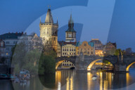 View over Charles Bridge, Old Town Bridge Tower and Vltava River at dusk, Prague, Bohemia, Czech Republic, Europe
