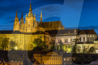 Illuminated Prague Castle and St. Vitus Cathedral seen from the banks of Vltava River, Prague, Bohemia, Czech Republic, Europe