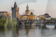View over Charles Bridge, Old Town Bridge Tower and Vltava River at last sunlight, Prague, Bohemia, Czech Republic, Europe
