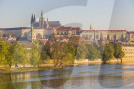 Prague Castle and St. Vitus Cathedral seen from the banks of Vltava River at first sunlight, Prague, Bohemia, Czech Republic