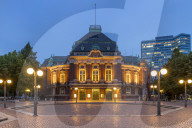 The illuminated Laeiszhalle concert hall at Johannes Brahms Square during dusk, Hamburg, Germany, Europe