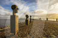 The sculpture group 'The Three Wise Men' (by Johannes Phillip) at the entrance to the harbor in the fishing Village of Wieck, Greifswald, Mecklenburg-Vorpommern, Germany