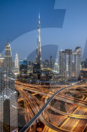 Burj Khalifa at sunset with the Dust Thani hotel and The Address near the huge intersection of Sheikh Zayed Road, Dubai, UAE