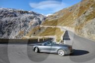 Convertible car driving downwards Pass road Stilfser Joch