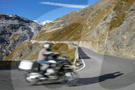 Motorbike driving up Pass road Stilfser Joch. Motion blur