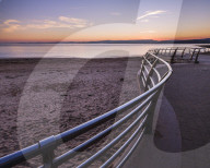 After sunset with the curved railings at the RNLI station, Exmouth, Devon, UK