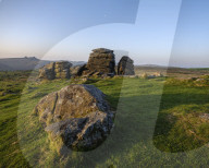 Warm sunlight on granite at Hound Tor in Dartmoor National Park, Bovey Tracey, Devon UK