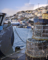 The colourful houses on the hillside above the harbour of Brixham, Devon, UK
