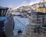 The colourful houses on the hillside above the harbour of Brixham, Devon, UK