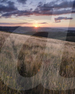 Sunrise from the grassy slopes of Trendlebere Down, Bovey Tracey, Devon UK
