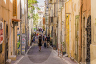 The narrow streets of the old town, Le Panier, in Marseille in France, Europe.