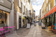 A street and restaurant scene in Fitrovia in London, England, United Kingdom, Europe.