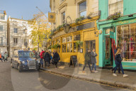 A street scene on Portobello Road, in Notting Hill, in London, England, United Kingdom, Europe.