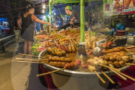 Grilled meats for sale at a food stall at Kamala night market in Phuket, Thailand, Southeast Asia, Asia.