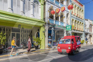 A tuk tuk taxi and Sino-Portuguese architecture in Phuket old town, Phuket, Thailand, Southeast Asia, Asia.