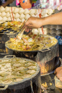 A fried seafood stall at the famous Walking Street night market in Phuket old Town, Phuket, Thailand, Southeast Asia, Asia.