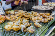 A fried seafood stall at the famous Walking Street night market in Phuket old Town, Phuket, Thailand, Southeast Asia, Asia.