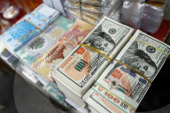 A shop selling Buddhist offerings for the temples. Hell bank notes and other forms of joss paper. Ho Chi Minh City. Vietnam.