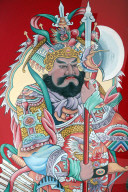 Hoi Tuong Te Nguoi Hoa buddist chinese temple. Guardian figure paintings on gate. Phu Quoc. Vietnam.