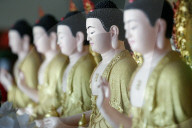 Hoi Tuong Te Nguoi Hoa buddist chinese temple. Row of buddha statues. Phu Quoc. Vietnam.