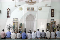 Saigon Central Mosque. Muslim men praying. Ho Chi Minh City. Vietnam.