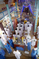 Cao Dai temple. Worshippers at service. Phu Quoc. Vietnam.