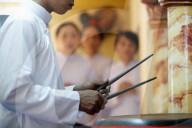 Cao Dai temple. Cao Dai worshipper play drums. Phu Quoc. Vietnam.