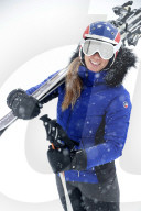 French Alps. Mont-Blanc massif. Young woman skier at ski resort in mountains. Saint-Gervais. France.