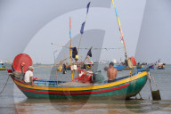 Fishermen repairing fishing nets. Hang Dua bay. Vung Tau. Vietnam.