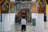 Sri Thenday Yutthapani Temple. Worshipper praying. Ho Chi Minh City. Vietnam.