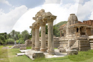 The Sas-Bahu Temples near Udaipur, India consist of two temples and a stone archway. Exquisite carvings depict Hindu dieties.