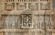 The Sas-Bahu Temples near Udaipur, India consist of two temples and a stone archway. Exquisite carvings depict Hindu dieties.