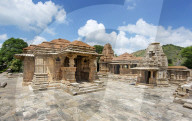 The Sas-Bahu Temples near Udaipur, India consist of two temples and a stone archway. Exquisite carvings depict Hindu dieties.