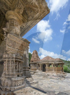 The Sas-Bahu Temples near Udaipur, India consist of two temples and a stone archway. Exquisite carvings depict Hindu dieties.