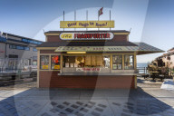Backlit Frankfurter stall next to Pier 54 in late afternoon, Alaskan Way, Downtown, Seattle, Washington, USA, North America
