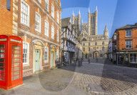 Lincoln Cathedral viewed from Exchequer Gate with red telephone visible, Lincoln, Lincolnshire, England, UK, Europe