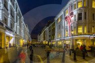 View of Christmas lights adorning Kings Street near Covent Garden at dusk, London, England, UK, Europe