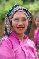 A Manggarai women eating betal nut which causes reddening of the tongue and teeth, western Flores, Indonesia.