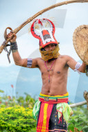 Caci men perform a traditional whip dance with bamboo shields and leather whips, western Flores, Indonesia.