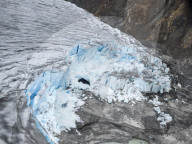 Aerial view of the Meade Glacier with calved ice in the Chilkat Range near Haines, Alaska, USA.
