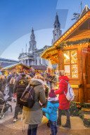 View of visitors and Christmas Market stalls at Christmas Market, Millenium Square, Leeds, Yorkshire, England, UK, Europe