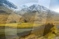 Isolated cottage in the Glencoe Valley during winter snow storm, Glencoe, Highland Region, Scotland, Europe