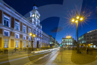 Trail lights and Real Casa de Correos at Puerta del Sol at dusk, Madrid, Spain, Europe