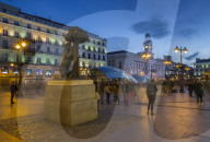 View of Bear and Strawberry Tree statue and Puerta Del Soll at dusk, Madrid, Spain, Europe