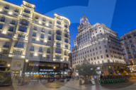 View of architecture illuminated on Gran Via at dusk, Madrid, Spain, Europe