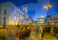 View of Real Casa de Correos and Easter Parade in Puerta del Sol at dusk, Madrid, Spain, Europe
